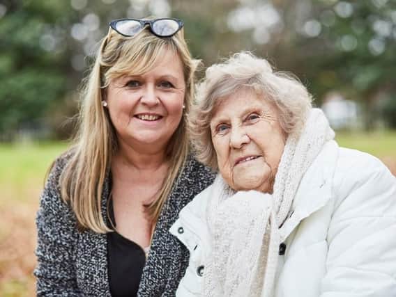 Sam Evans with her mum Dotty Harman. Sam, 53 from Portsmouth, is taking part in Alzheimer's Society's Portsmouth Memory Walk in October. Dotty was diagnosed with dementia seven years ago. Picture: Alzheimer's Society/Lucy Pope