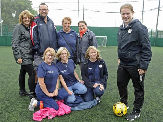Gemma Morrison, far-right, with helpers from left Jan Neal and Steve Neal, Sally Sines and Sarah Balchin from QA, front Liz Jones, Mandy Baker and Kari Pratt. Picture: Ian Hargreaves