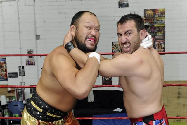 Andy Simmonz who runs the Portsmouth Wrestling School, wrestling with Great-O-Kharn