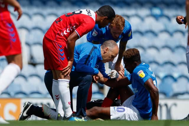 Jamal Lowe receives treatment following his FC Utrecht injury Picture: Ben Queenborough