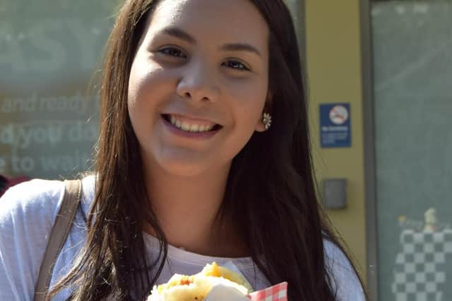 Ediana Crespo enjoys a tasty arepa