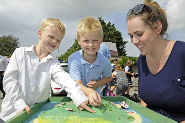 From left, Arthur Snook (six), his brother Harvey (nine), and teacher Helen Stubbs. Picture: Ian Hargreaves