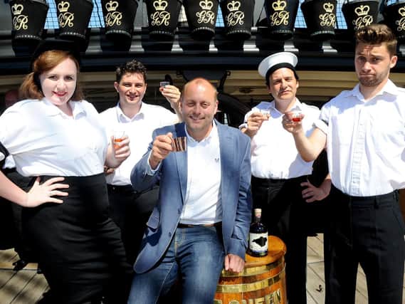 Isle of Wight Distillery launched their HMS Victory Rum on board HMS Victory for Black Tot Day. From left: Millie Bennison, Martin Jakeman, Xavier Baker from the Isle of Wight Distillery, Daniel McCrohon and John Faulkner     Picture: Sarah Standing (180583-302)