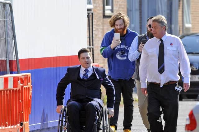 Oliver Redmond (in wheelchair) of Stirling Street, Portsmouth, Hampshire, arrives at Portsmouth Magistrates Court