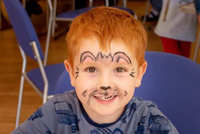 Noah Johnson decorating biscuits at the All Saints Church Teddy Bears' Picnic