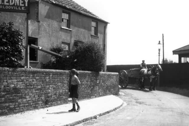 The corner of New Road and Bedhampton Road, Bedhampton, circa 1920 with a derelict house ready to be demolished. Picture: Barry Cox