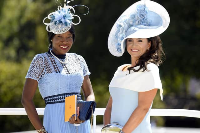 It's a blue and white day at Goodwood as race-goers try to win a best-dressed competition offering a prize of a racing holiday to South Africa / Picture by Malcolm Wells