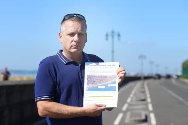 Carl Parker with his leaflet explaining some of the issues with one of the sea defence options
