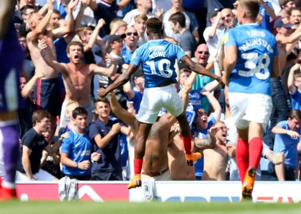 Jamal Lowe of Pompey runs away to celebrate the first goal. Picture: Andrew Fosker / PinPep