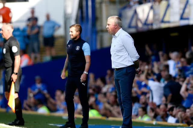 Luton boss Nathan Jones and Pompey manager Kenny Jackett. Picture: Andew Fosker