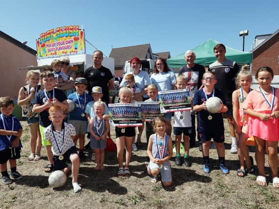 Children with organisers and helpers including staff from Pompey in the Community. Family Fun Day at Stamshaw and Tipner Community Centre, Portsmouth, in support of children with special needs. Picture: Chris Moorhouse