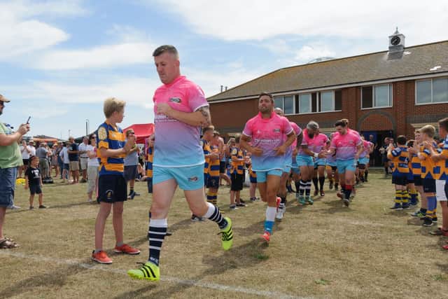 Action from the charity rugby match in Southsea