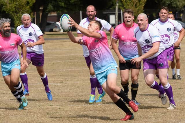 Action from the charity rugby match in Southsea