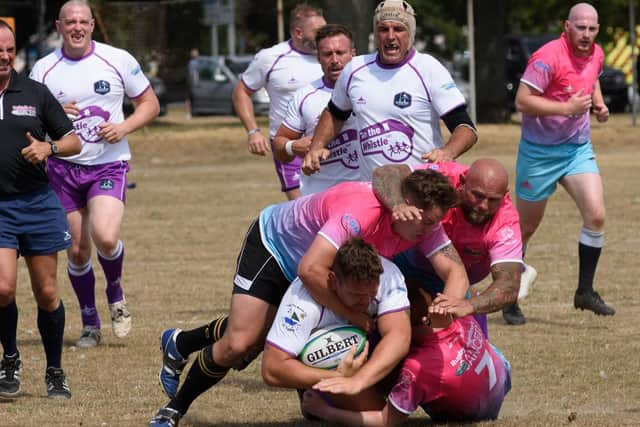Action from the charity rugby match in Southsea