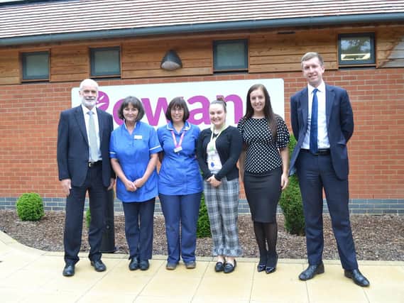 Churchers Solicitors with volunteers after a visit to Rowans Hospice, L-R: Managing partner, Ian Robinson, Rowans Hospice team members, trainee solicitor Georgia Chandler, and trainee solicitor Daniel Norris
