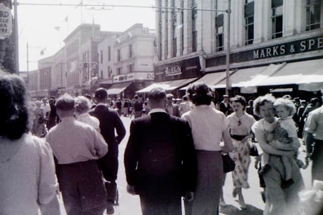 Looking south along Commercial Road in either 1956 or 1960. The crowd was drawn by the circus parade.