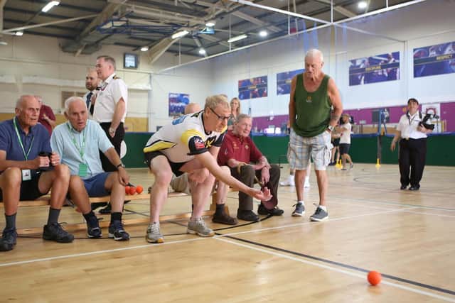 Veteran, Charlie Eastwood having a go on indoor bowls