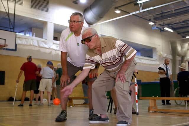 Veteran, Horace Hoskins has a go on indoor bowls