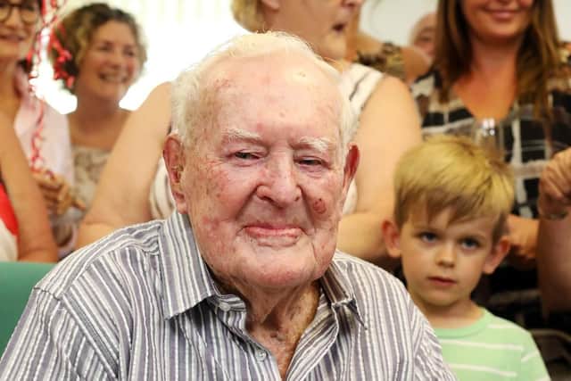 Syd Crossland celebrates his one hundredth birthday with family, friends and well-wishers at Rivermead Court, Emsworth.
