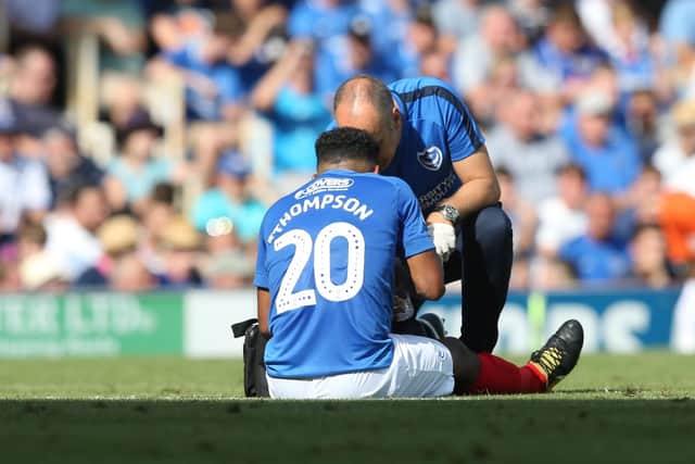 Nathan Thompson receives treatment from Bobby Bacic.