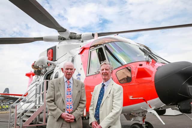 From left: Barnbrook systems managing director Tony Barnett and Sir Donald Spiers, chairman of Farnborough Aerospace Consortium, in front of a Leonardo helicopter fitted with Barnbrooks innovative refuelling switch