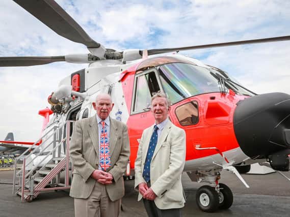 From left: Barnbrook systems managing director Tony Barnett and Sir Donald Spiers, chairman of Farnborough Aerospace Consortium, in front of a Leonardo helicopter fitted with Barnbrooks innovative refuelling switch