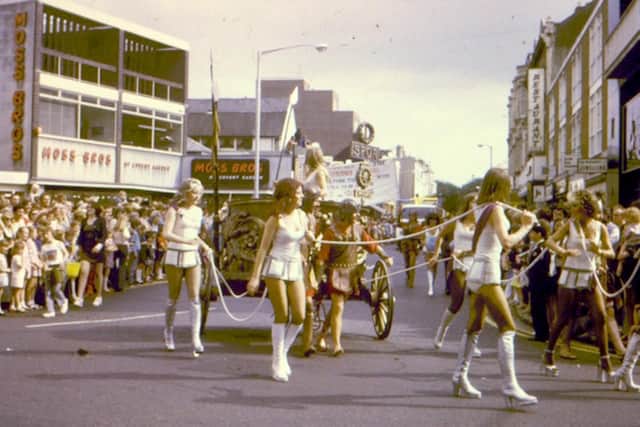 Girls from the seafront casino Club Tiberius pull a chariot from Palmerston Road into Osborne Road, Southsea, 1974. Picture: Kevin Munks