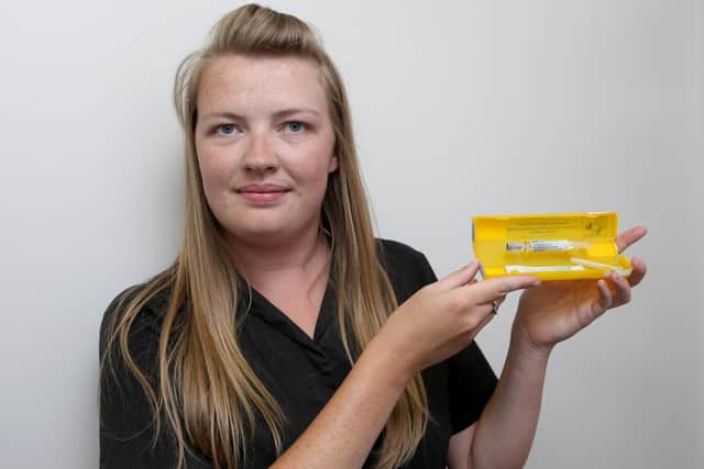Sophie-Marie Furmedge with the antidote drug at Laly's Pharmacy in Guildhall Walk, Portsmouth
