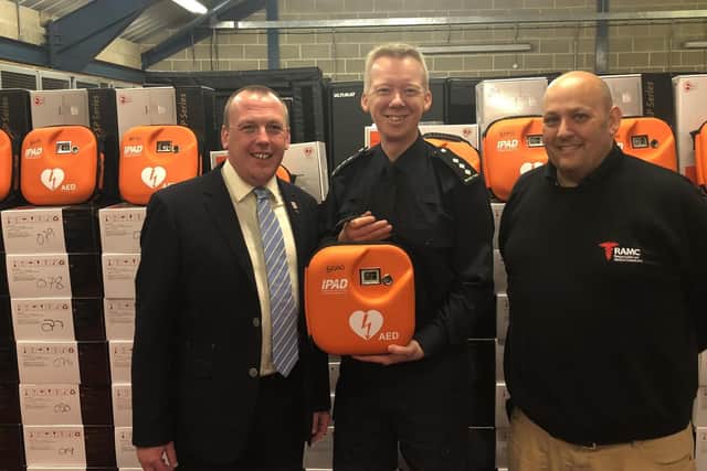 Paul Watts (left), Head of International Business Development at SP Services, which supplied 110 defibrillators to Border Force with resuscitation expert Stephen Furnell and Border Force Senior Officer Neil Dangerfield.