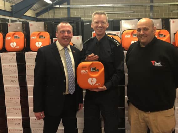 Paul Watts (left), Head of International Business Development at SP Services, which supplied 110 defibrillators to Border Force with resuscitation expert Stephen Furnell and Border Force Senior Officer Neil Dangerfield.