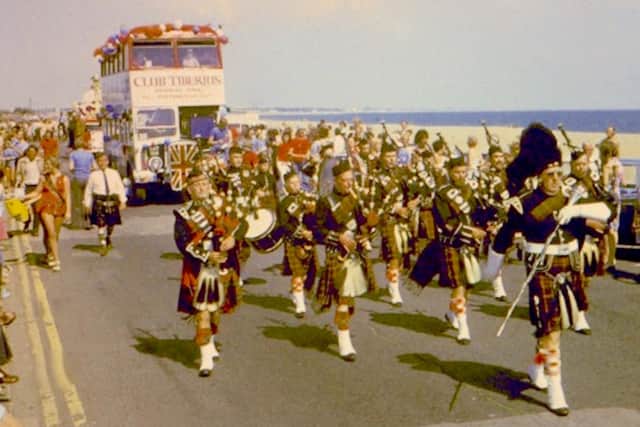 A pipe band leads the Club Tiberius along Eastney Esplanade, 1974. Picture: Kevin Munks