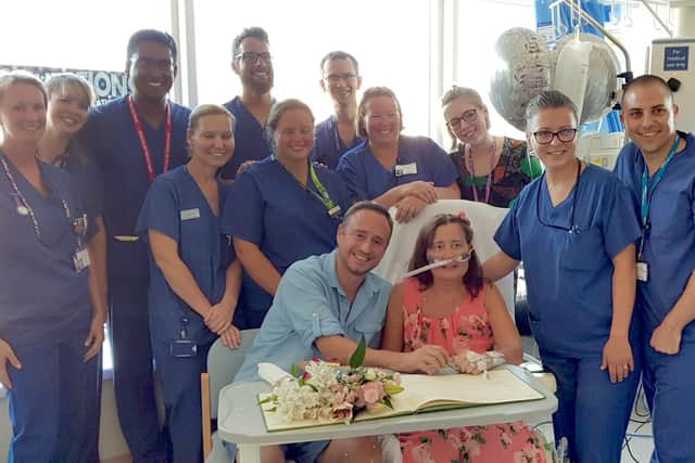 Marcus and Linda with staff from QA