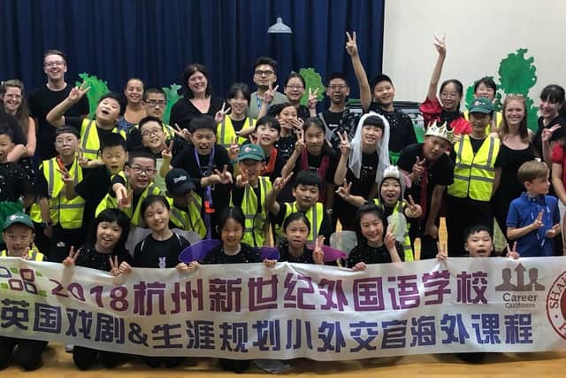 The children of Zhejiang Province celebrate their performance of Midsummer Night's Dream