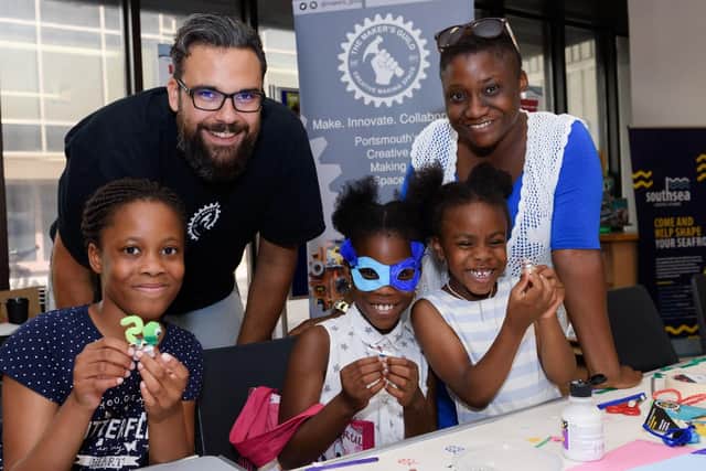 The 'Brushbot' electronics workshop, from left, Gabby Falano, nine, Sam Asiri of the Makers Guild, with Shekinah, Neriah and mum Yemisi Olaiya Picture: Duncan Shepherd