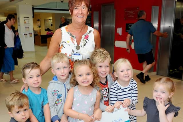 Pictured is: (back middle) Sister Lee Campbell with (front l-r) Jack Huntley (3), Alfie Harris (3), Marley Roberts (4), Mia Carter (4), Max Mulcay (4), Francesca Read (4) and Ayla Scissons (3) from Little Peoples Nursery in Drayton, who have raised some money towards the bereavement suite.