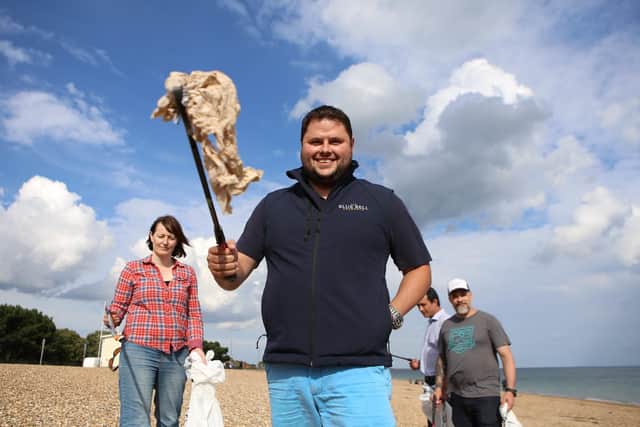 Giles Babb picking up some rubbish. Picture: Habibur Rahman