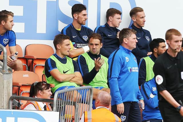Brett Pitman, centre, on the bench against Blackpool Picture: Joe Pepler