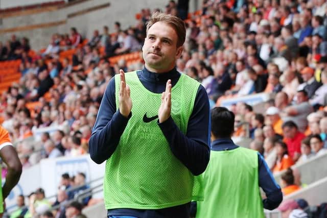 Brett Pitman warms up against Blackpool. Picture: Joe Pepler