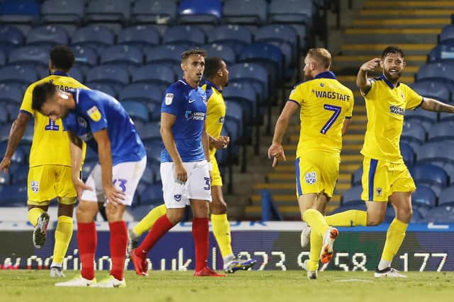 AFC Wimbledon celebrate their win over Pompey. Picture: Joe Pepler