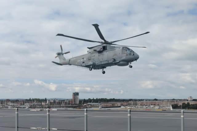 A Merlin Mk2 from 820 Naval Air Squadron landing on HMS Queen Elizabeth