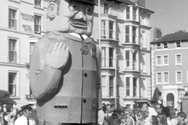 Another Kevin Munks' photo of the 1974 Portsmouth carnival with a giant postman outside the Queen's Hotel, Southsea.