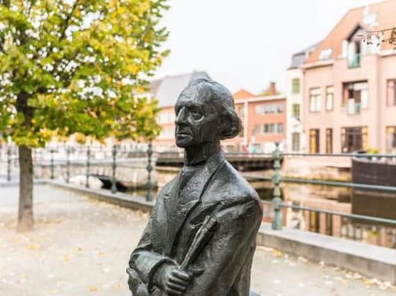 Statues aplenty adorn Mechelen streets.