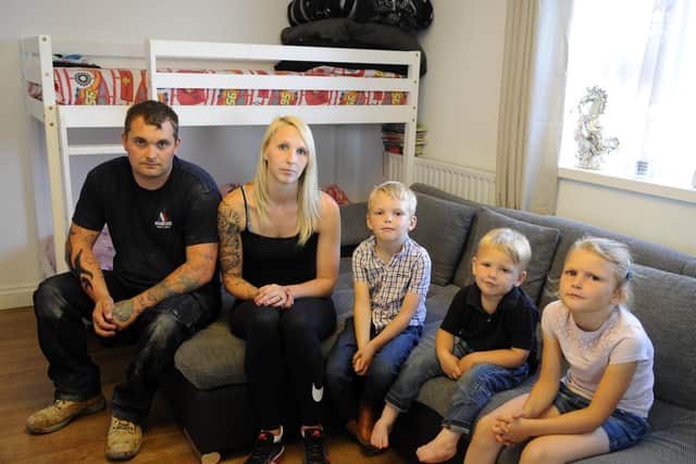 From left, Joe Lewis, his wife Charmane, and Claudy, Tommy and Lilly-Rose in a one bedroom flat in Cosham where they all had to live for a while
Picture: Malcolm Wells (180614-4014)