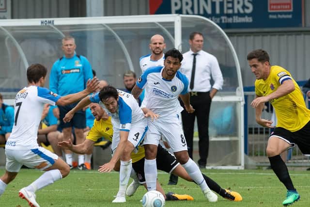 Theo Lewis competing for the Hawks against AFC Fylde. Picture: Joe Pepler