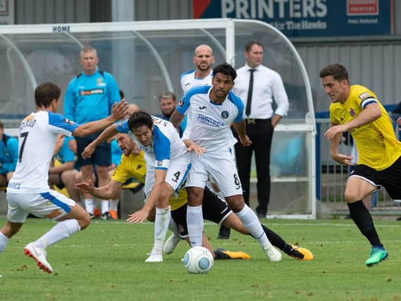 Theo Lewis competing for the Hawks against AFC Fylde. Picture: Joe Pepler