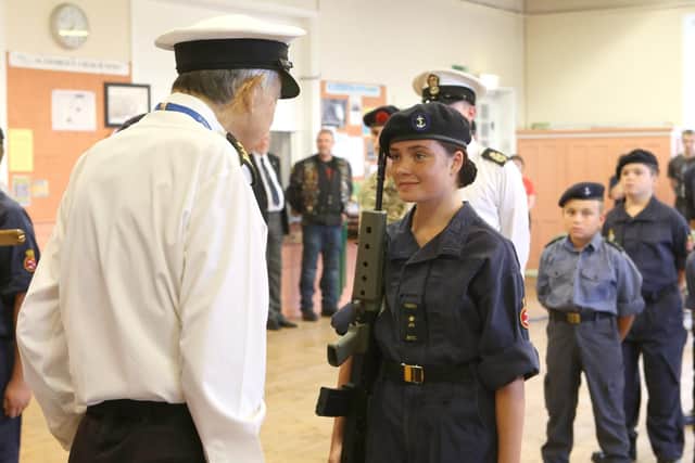 Tony Crisp carrying out an inspection at the ceremony. Picture: Habibur Rahman