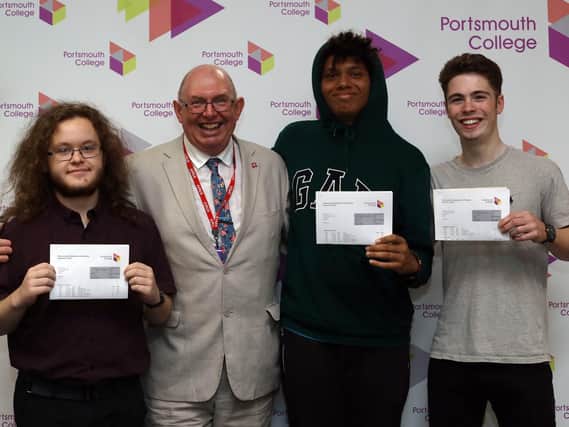 Principal Steve Frampton with students, from left, Adam Lowe, Michael Hirst and Nathan Clark. Picture: Chris Moorhouse