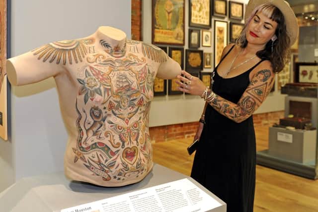 Derryth Ridges at the British Tattoo Art Revealed exhibition at the National Museum of the Royal Navy, in Portsmouth
