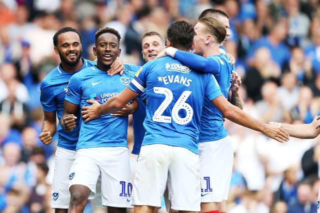 The Pompey players celebrate Gareth Evans' opener Picture: Joe Pepler