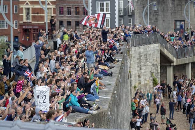Thousands of people watched as the aircraft carrier set sail from her home city. Photo: Steve Parsons/PA Wire